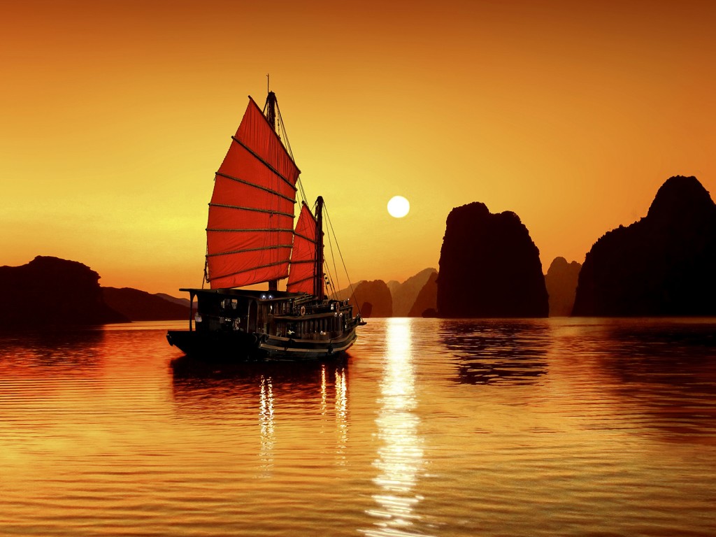 Junk in the sea of Halong Bay, a UNESCO World Natural Heritage Site, Karst mountains, romantic sunset, image composition, Vietnam, Asia